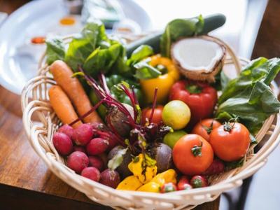 bowl of fresh fruits and vegetables on table