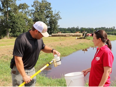 Max Knowles collecting lagoon sample