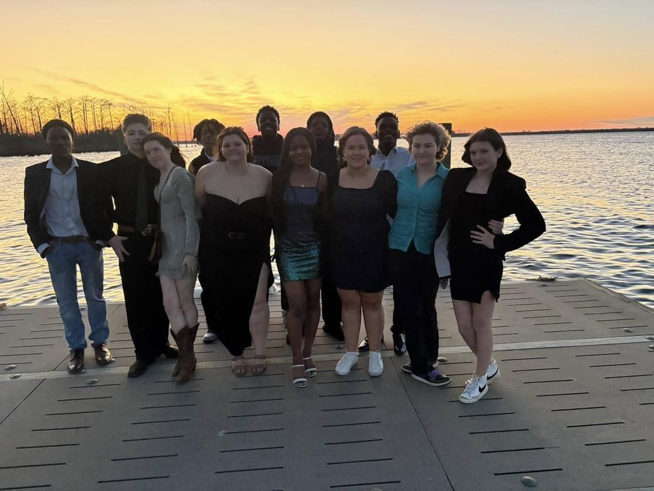 Youth standing on a doc 