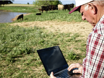 A farmer working on his computer used an example to show the use of AI in local food work.