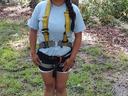 youth in high ropes harness