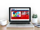 Laptop Screen open to New Extension Website Homepage
