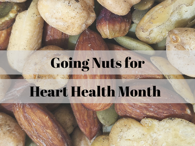Mixed nuts background with overlaid text: "Going Nuts for Heart Health Month"
