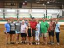2026 State Show Dedication Recipient Wayne Moore and his family, friends, and Extension colleagues in the main arena of the Hunt Horse Complex