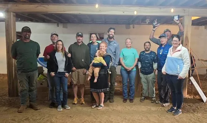 Farmers in a barn