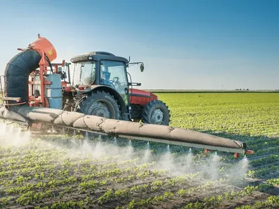 Tractor spraying