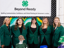 State 4-H Officers, wearing their official green jacket attire, posed together for a group photo at the NC 4-H booth of the 2025 N.C. State Fair.