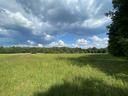 Open field with blue sky at Farm Campus