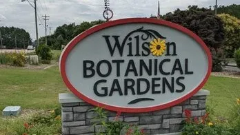 Entrance sign for the Wilson Botanical Gardens