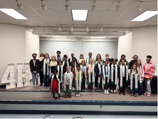 Halifax County 4-H youth and adult leaders posing together on stage during the annual 4-H Achievement Celebration, recognizing youth accomplishments, leadership, and participation in 4-H programs.