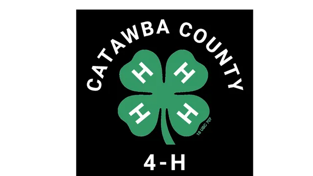The 4-H Clover with Catawba County curved above the Clover and 4-H below with Clover.