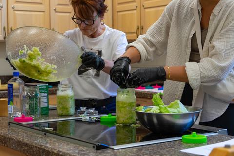 Participants jaring their sauerkraut during food preservation class