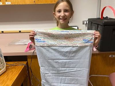 4-H'er holding pillowcase