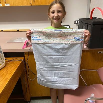 4-H'er holding pillowcase
