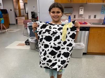 4-her holding pillowcase