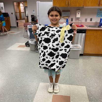 4-her holding pillowcase