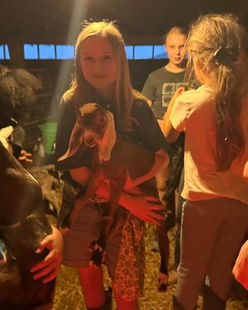 4-H Club leader holding goat