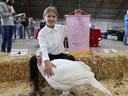 reserve champion junior 2025 winner with banner and her turkey in the showring