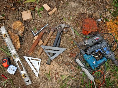 A variety of tools lay on the ground.