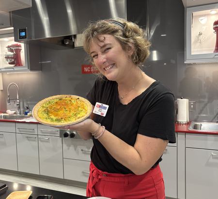 Abigail holding a cooked quiche