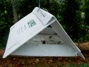 White insect tent trap in apple orchard