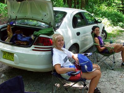 People taking lunch break by car