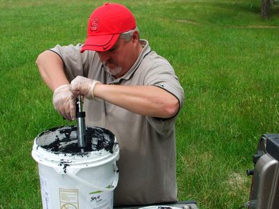 Person working with SPLAT mating disruption pheromone