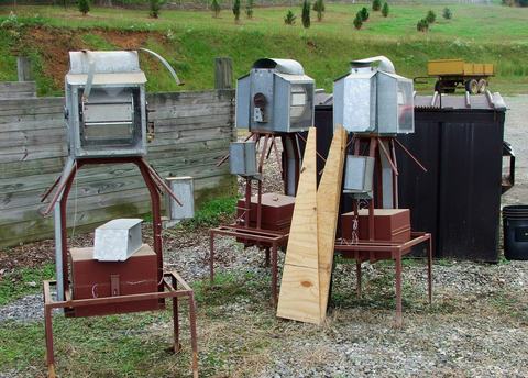 Large homemade metal devices standing in a row outside