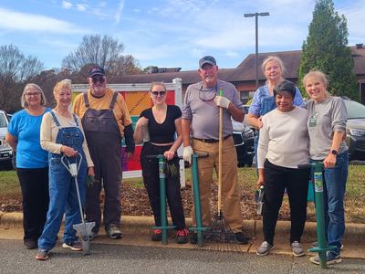 Volunteers help elementary students plant daffodils at their schools