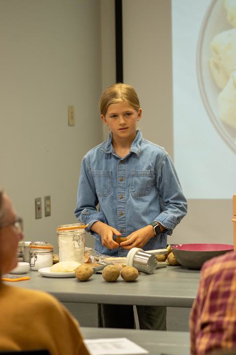Youth demonstrating how to make gnocchi at home