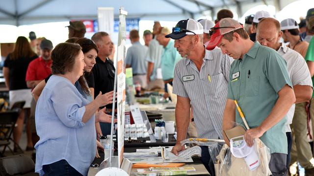 Farmers and vendors chat at the annual Northeast AgExpo in Elizabeth City.