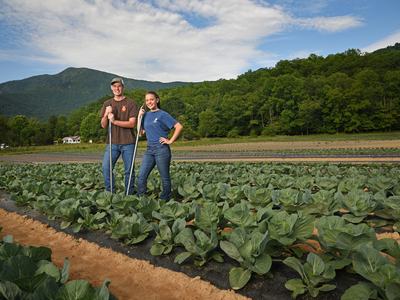 Farmers standing in field