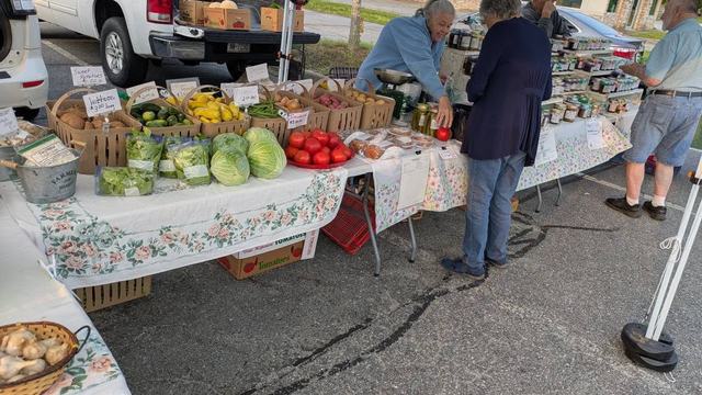 Woman selling vegetables at Farmers Market
