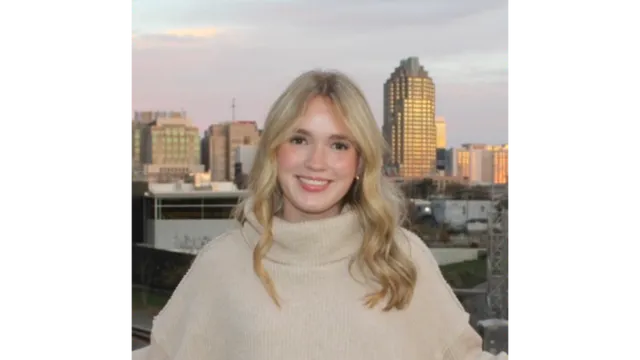 woman standing in front of a cityscape