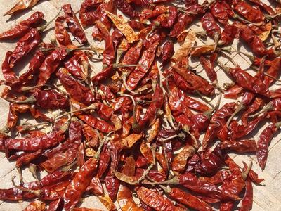 Dried peppers on a white table.