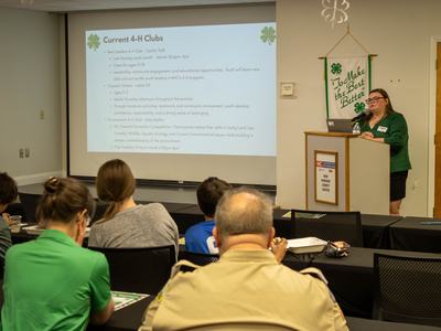 Cecilia Tadt giving a presentation on New Hanover 4-H Program.