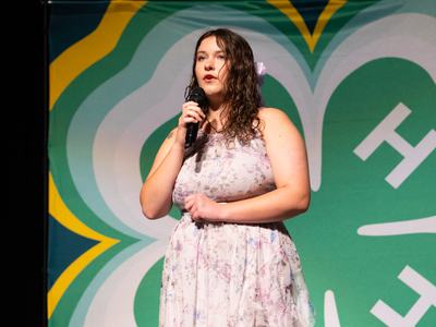4-H member performs a vocal selection on stage during the 4-H Entertains competition at Northeast District Activity Day.