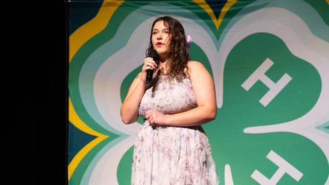 4-H member performs a vocal selection on stage during the 4-H Entertains competition at Northeast District Activity Day.