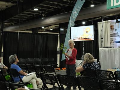 An NC State Master Gardener Volunteer of Wake County gives a presentation at the 2025 Southern Ideal Home Show.