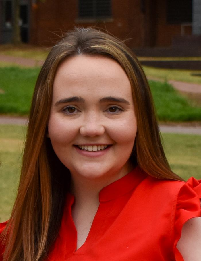 headshot of Leanna Turner wearing red blouse