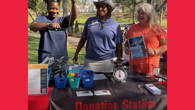 Donation Station Volunteers ring the bell to start the opening of the Belmont Farmer's Market.