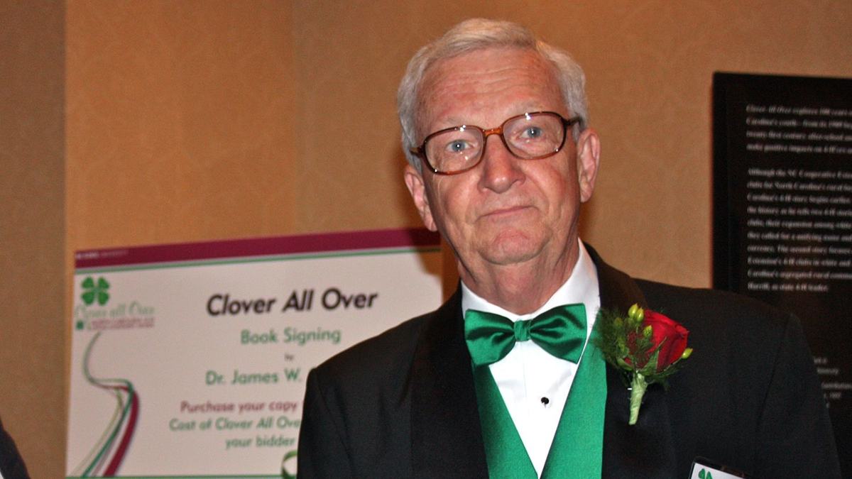 Dr. Jim Clark stands at a book signing event.