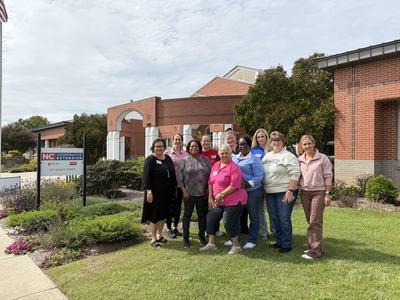 group photo of staff outside Pitt County Building