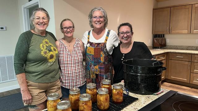 Extension Master Food Volunteers standing in the Extension Kitchen
