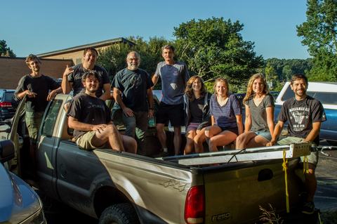Group photo of 2019 Entomology work crew in back of pickup truck