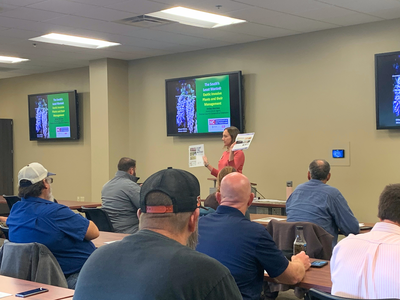 Extension Agent teaching landscapers about proper pesticide usage.