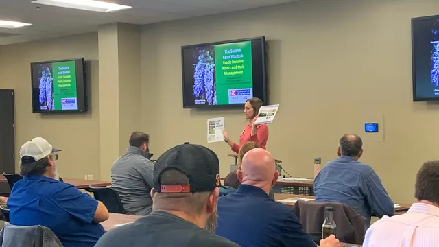 Extension Agent teaching landscapers about proper pesticide usage.