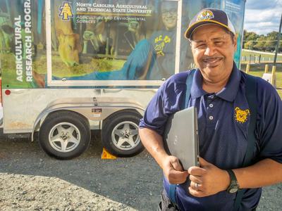 Gregory Goins, dean of N.C. A&T State University's College of Agriculture and Environmental Sciences, stands in front of an N.C. A&T trailer.