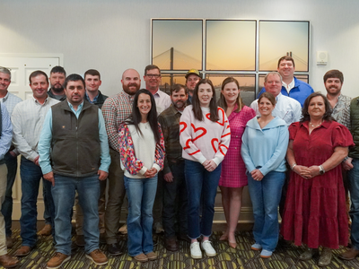 Group of 19 people smiling