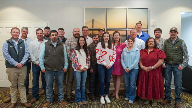 Group of 19 people smiling